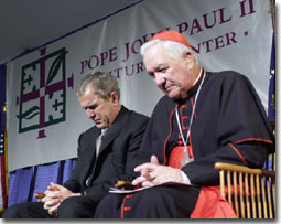 President Bush prays with Cardinal Maida at the dedication of the Pope John Paul II Cultural Center in Washington March 22, 2001.