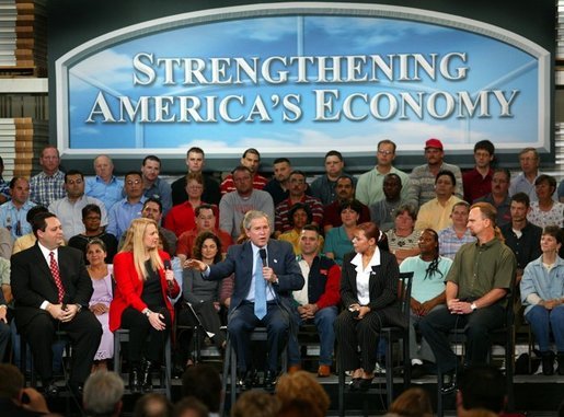 President George W. Bush leads the on stage discussion during a conversation on the economy with employees at Nu-Air Manufacturing Company in Tampa, Florida, Monday, Feb. 16, 2004. White House photo by Eric Draper