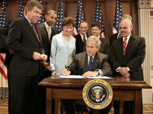 President George W. Bush signs into law S.2590, the Federal Funding Accountability and Transparency Act of 2006, Tuesday, Sept. 26, 2006, in the Dwight D. Eisenhower Executive Office Building. Looking on are Sen. Susan Collins, R-Maine, Chairwoman of the Homeland Security and Governmental Affairs Committee, and from left: Rep. Roy Blunt of Missouri, Sen. Barack Obama, D-Ill., Sen. Tom Carper, D-Del., Rep. Jeb Hensarling of Texas, and Rep. Henry Waxman of California. White House photo by Kimberlee Hewitt