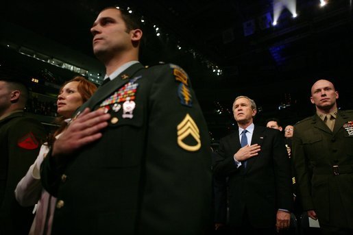 During an event honoring members of the U.S. military, President George W. Bush stands with U.S. Marine Corps Capt. Brian R. Chontosh, right, at the MCI Center in Washington, D.C., Tuesday, Jan. 18, 2005. White House photo by Eric Draper