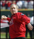 President George W. Bush throws out the first pitch during the St. Louis Cardinals. season opener against the Milwaukee Brewers at Busch Stadium in St. Louis, Mo., Monday, April 5, 2004.