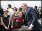 President George W. Bush poses for a photo with a port worker at the Blount Island Marine Terminal Tuesday, March 18, 2008, in Jacksonville, Fla. White House photo by Chris Greenberg