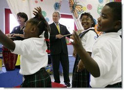President George W. Bush and Louisiana Governor Kathleen Blanco, left, play musical instruments during a children's program at the Dr. Martin Luther King Jr. Charter School for Science and Technology, Wednesday, Aug. 29, 2007, in New Orleans. White House photo by Chris Greenberg