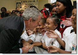 President George W. Bush greets students at the Dr. Martin Luther King Jr. Charter School for Science and Technology Wednesday, Aug. 29, 2007, in New Orleans. White House photo by Chris Greenberg