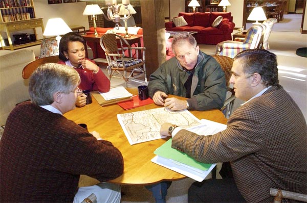President George W. Bush receives a briefing during a meeting with CIA Director George Tenent, right, National Security Advisor Condoleezza Rice, and Chief of Staff Andy Card at Camp David, Saturday, Sept. 29, 2001. White House photo by Eric Draper.