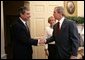 President George W. Bush welcomes Secretary of Commerce Carlos Gutierrez and his wife Edilia Gutierrez to the Oval Office Monday, Feb. 7, 2005. Mr. Gutierrez, a native of Cuba and former chairman of the board and chief executive officer of the Kellogg Company, was sworn in by White House Chief of Staff Andrew Card earlier in the day. White House photo by Eric Draper