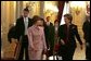 Laura Bush walks with Queen Paola of Belgium during a tour of the Royal Palace of Belgium in Brussels Monday, Feb. 21, 2005. White House photo by Susan Sterner