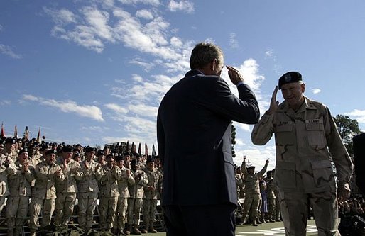 President George W. Bush salutes Major General Buford Blount, Commander of the 3rd Infantry Division (Mechanized) before addressing military personnel and their families at Ft. Stewart, Ga., Friday, Sept. 12, 2003. White House photo by Paul Morse