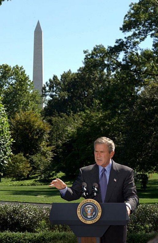 President George W. Bush discusses his Clear Skies Initiative in the East Garden Tuesday, Sept. 16, 2003. The initiative mandates a 70 percent cut in air pollution from power plants over the next 15 years, including the first-ever national cap on mercury emissions. White House photo by Tina Hager.