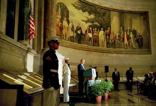 President George W. Bush delivers remarks at the rededication ceremony of the National Archives Wednesday, Sept. 17, 2003. During the ceremony, the Declaration of Independence, the Constitution, and the Bill of Rights were unveiled. "In the course of two centuries, the ideals of our founding documents have defined America's purposes in the world," said the President. "Since July 4th, 1776, to this very day, Americans have seen freedom's power to overcome tyranny, to inspire hope even in times of great trial, to turn the creative gifts of men and women to the pursuits of peace." White House photo by Paul Morse