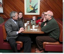 President George W. Bush visits with diner patrons, Tuesday morning, Jan. 30, 2007, following a breakfast meeting with small business leaders at The Sterling Family Restaurant in Peoria, Ill., to talk about the economy. White House photo by Paul Morse