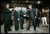 President George W. Bush greets the stage participants at the end a conversation on the economy at SRC Automotive in Springfield, Mo., Monday, Feb. 9, 2004. From left, they are Mike Sadler, President of Custom Manufacturing and Polishing; Tricia Derges, CEO of Mostly Memories; Jack Stack CEO of SRC Automotive; Teresa Noblitt, SRC Automotive accountant; and Gary Brown, SRC Automotive Warehouse Supervisor.