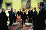 President George W. Bush and Laura Bush share a light moment with British Prime Minister Tony Blair and their staffs during a visit to the White House Friday, January 31, 2003. White House photo by Eric Draper.