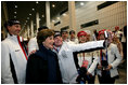 Laura Bush poses for photos with 2006 U.S. Winter Olympic athletes in Turin, Italy, Friday, Feb. 10, 2006 before the Opening Ceremony.