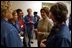 Laura Bush visits with military wives at the Fort Hood Women's Conference in Fort Hood, Texas, Friday, March 5, 2004. "Today, we celebrate you, the women in the United States military who are married to military officers or enlisted men, or who are military women, themselves. And we celebrate all that you do to make our military the strongest in the world," said Mrs Bush in her remarks to the conference.