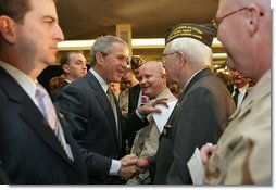 After talking about progress in the War on Terror with members of the Veterans of Foreign War, President George W. Bush greets audience members in Washington, D.C., Jan. 10, 2006. "This is one of America's great organizations. I appreciate the proud and patriotic work you do across America," said the President.  White House photo by Paul Morse
