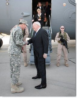 Vice President Dick Cheney is greeted by General David Petraeus, Commanding General of Multi-National Forces Iraq, as his wife Mrs. Lynne Cheney and daughter Liz Cheney deplanes in Baghdad, Monday, March 17, 2008. The visit is the Vice President's third to Iraq and comes during the fifth anniversary of the beginning of the U.S.-led campaign to liberate the Iraqi people.  White House photo by David Bohrer
