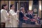 President George W. Bush and Mrs. Laura Bush attend mass at the Cathedral of Saint Matthew the Apostle in Washington, DC on Saturday, April 2, 2005 in remembrance of Pope John Paul II. White House photo by Paul Morse