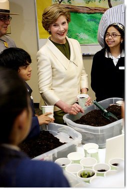 Mrs. Laura Bush joins students from the Williams Preparatory School in Dallas, Thursday, April 10, 2008, during a seed planting demonstration at the First Bloom program to help encourage youth to get involved with conserving America's National Parks. The First Bloom program is being introduced in five cities across the nation to give children a sense of pride in our natural resources and to be good stewarts of America's diverse environment. White House photo by Shealah Craighead