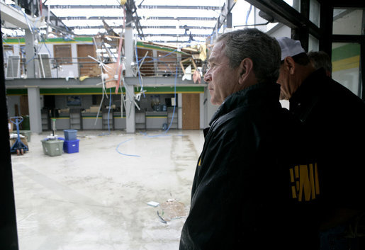 President George W. Bush views the damage done last week's deadly tornado during a stop at the John Deere dealership in Greensburg, Kansas Wednesday, May 9, 2007. At least 11 people died and more than 90 percent of the town was destroyed in the wake of the storm that struck Friday night. White House photo by Eric Draper