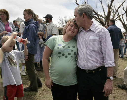 President George W. Bush comforts a survivor of Friday's deadly tornado during his visit Wednesday, May 9, 2007, to Greensburg, Kansas. The tornado, spanning more than 1.5 miles, destroyed more than 90 percent of the town, leaving 11 dead in its wake. White House photo by Eric Draper