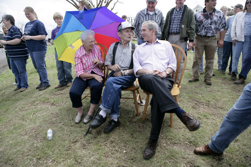 President George W. Bush spends a moment with Cloriene and Kenneth Smith, survivors of Friday's deadly tornado in Greensburg, Kansas, during his visit to the storm-ravaged area Wednesday, May 9, 2007. White House photo by Eric Draper