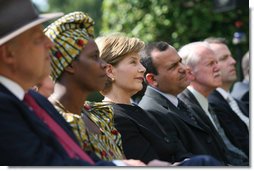 Mrs. Laura Bush listens to participants during a celebration of World Refugee Day Friday, June 20, 2008, in the East Garden of the White House. The event acknowledged the compassion of the American people in welcoming refugees into U.S. society and highlighting their contributions. White House photo by Shealah Craighead