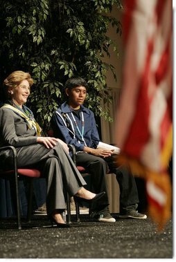 Laura Bush sits with 16-year-old Derwin Tekala, a participant in the Red Road Youth Empowerment Project, before delivering remarks at the Heard Museum in Phoenix, Ariz., April 26, 2005. Mrs. Bush discussed the role of strong family and cultural bonds in helping children resist negative social pressures.  White House photo by Krisanne Johnson