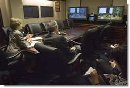 Joined by U.S. Secretary of Commerce Carlos Gutierrez, right, Mrs. Laura Bush talks with the Ladies in White via a video teleconference Thursday, Oct. 16, 2008, in the Situation Room of the White House. The Ladies in White is an organization that includes spouses and other relatives of jailed Cuban dissidents. The organization was formed in 2003 to protest the arrest of 75 dissidents by the Cuban regime. Members of the organization have been consistently detained, threatened, and at times beaten by police during their peaceful protests.  White House photo by Joyce N. Boghosian