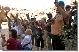 A group of tourists from Texas wave to Mrs. Laura Bush while touring Petra Friday, Oct. 26, 2007, in southern Jordan. Last year more than 300,000 visitors from around the world toured the ancient ruins. White House photo by Shealah Craighead