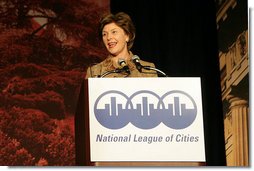 Mrs. Laura Bush addresses an audience Tuesday, March 14, 2006 at the National League of Cities Conference in Washington, asking for their communities continued support of the Helping America's Youth initiative. White House photo by Shealah Craighead