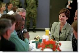 Mrs. Bush talks with teachers at Pinckney Elementary School in Columbia, South Carolina during a visit to Fort Jackson for a Troops to Teachers rally May 8, 2001.  White House photo by Paul Morse