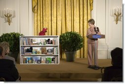 Mrs. Laura Bush talks with Elmo, a puppet on the children's television show Sesame Street, in the East Room of the White House, Saturday, September 30, 2006, during the seventh annual National Book Festival opening ceremony in Washington, D.C. The festival, held on the grounds of the National Mall, will include author readings, book signings, musical performances, and storytelling for children, adults and families. More than 80 noted authors and artists from around the country will participate. White House photo by Shealah Craighead