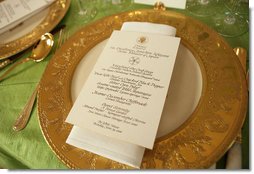 A place setting of the Clinton State Service is on display during the preview of the table setting for the official dinner honoring His Excellency Junichiro Koizumi, Prime Minister of Japan, in the State Dining Room Thursday, June 29, 2006. The tables are draped with jasmine green silk tablecloths. The floral centerpieces are comprised of pave spheres of green cymbidium orchids. White House photo by Shealah Craighead