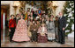 President George W. Bush and Mrs. Laura Bush pose for a photo with the Ford's Theater cast members of “A Christmas Carol,” following their performance Monday, Dec. 3, 2007, at the White House Children’s Holiday Reception. White House photo by Shealah Craighead