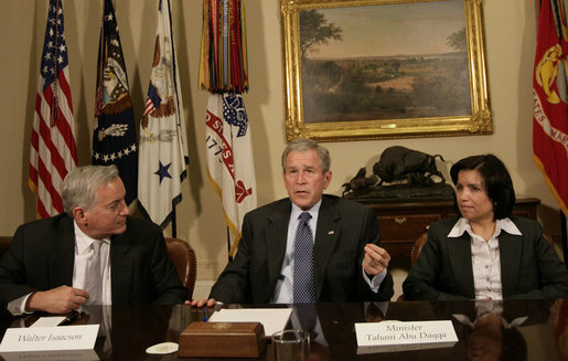President George W. Bush is joined by Walter Isaacson, President and CEO, Aspen Institute, and Tahani Abu Daqqa, Palestinian Minister of Youth and Sports, during a meeting Monday, Dec. 3, 2007, with U.S.-Palestinian Public-Private Partnership in the Roosevelt Room of the White House. The partnership is aimed at promoting economic opportunity and leadership development for Palestinian youth. White House photo by Eric Draper