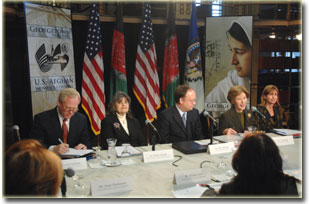 First Lady Laura Bush speaks at the 10th meeting of the U.S.-Afghan Women's Council and is joined at the table, from left to right, by Council member, Timothy McBride; Director of Georgetown University's Center for Child and Human Development, Dr. Phyllis Magrab; Georgetown University President John DeGioia; and State Department Under Secretary of Democracy and Global Affairs, Paula Dobriansky.