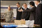 President George W. Bush attends a briefing Thursday, Aug. 7, 2008, at the U.S. Ambassador's residence in Bangkok on the ongoing Cyclone Nargis disaster relief efforts in Burma. From left are: Col. Al Swanda, Chief Joint U.S. Military Group Thailand; Eric John, U.S. Ambassador to Thailand; President Bush; Olivier Carduner, Mission Director of the USAID Regional Development Mission for Asia, and Bill Berger, Acting Senior Regional Advisor for the USAID Cyclone Nargis Disaster Assistance Response Team. White House photo by Eric Draper