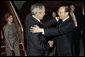 President George W. Bush and Mrs. Laura Bush are greeted by China's Foreign Minister Yang Jiechi, upon their arrival Thursday, Aug. 7, 2008, at Beijing Capitol International Airport in Beijing, where they will attend the opening ceremonies for the 2008 Summer Olympic Games on Friday. White House photo by Eric Draper