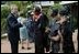 President George W. Bush talks with women who are members of Women and Children of Hope and the Nigerian Community of Western Living with AIDS at National Hospital in Abuja, Nigeria on July 12, 2003.