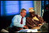 President George W. Bush talks with President Olusegun Obasanjo of Nigeria during a G8 Summit working session in Evian, France, June 1, 2003. The G8 leaders and the leaders of the New Partnership for Africa's Development (NEPAD) highlighted greater cooperation between the G8 and NEPAD and discussed challenges and opportunities going forward. President Bush and President Obasanjo are working together to forge an African Action Plan that removes obstacles of trade barriers, illiteracy, infectious disease, unsustainable debt and hunger. President Bush and President Obasanjo agreed that such a partnership must be based on mutual respect and responsibility. 