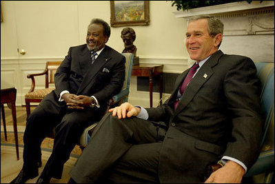 President George W. Bush and President Ismail Omar Guelleh of Djibouti greet the press during a meeting in the Oval Office Jan. 21, 2003. President Bush and President Guelleh discussed the issues affecting the common interests of the United States and Djibouti. The President thanked President Guelleh and the Djiboutian people for their continued cooperation on the global war on terrorism. The President announced that the United States will open a USAID office in Djibouti to more effectively address both humanitarian and development efforts. 
