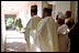 The Nigerian delegation stands along the colonnade as President George W. Bush talks with Nigerian President Olusegun Obasanjo May 11, 2001. President Bush thanked President Obasanjo for sending a message of tolerance and respect and assured him that the global war on terrorism is a fight against terror and evil and not against Muslims, whose Islamic faith teaches peace and respect for human life.