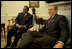 President George W. Bush and President Ismail Omar Guelleh of Djibouti greet the press during a meeting in the Oval Office Jan. 21, 2003. President Bush and President Guelleh discussed the issues affecting the common interests of the United States and Djibouti. The President thanked President Guelleh and the Djiboutian people for their continued cooperation on the global war on terrorism. The President announced that the United States will open a USAID office in Djibouti to more effectively address both humanitarian and development efforts. 