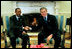 President George W. Bush meets with President Paul Kagame of Rwanda in the Oval Office Tuesday, March 4, 2003. 