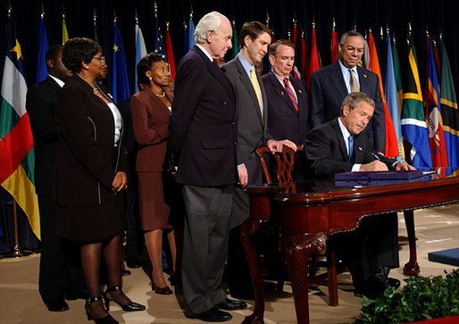 President George W. Bush signs H.R. 1298, the United States Leadership Against HIV/AIDS, Tuberculosis, and Malaria Act of 2003, at the State Department in Washington, D.C., Tuesday, May 27, 2003. The legislation commits $15 billion to fight AIDS abroad. White House photo by Tina Hager.