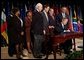 President George W. Bush signs H.R. 1298, the United States Leadership Against HIV/AIDS, Tuberculosis, and Malaria Act of 2003, at the State Department in Washington, D.C., Tuesday, May 27, 2003. The legislation commits $15 billion to fight AIDS abroad. White House photo by Tina Hager.