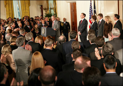 President George W. Bush welcomes an audience to the swearing-in ceremony for U.S. Supreme Court Justice Samuel A. Alito, Tuesday, Feb. 1, 2006 in the East Room of the White House, joined by Altio's wife, Martha-Ann, their son Phil, daughter, Laura, and U.S. Supreme Court Justice John Roberts.