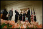 President George W. Bush, left, looks on during the swearing-in ceremony for U.S. Supreme Court Justice Samuel A. Alito, Tuesday, Feb. 1, 2006 in the East Room of the White House, sworn-in by U.S. Supreme Court Chief Justice John Roberts. Altio's wife, Martha-Ann, their son Phil and daughter, Laura, are seen center-background. White House photo by Paul Morse