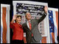 President George W. Bush and Mrs. Bush wave to the audience following the President's remarks on the 2006 agenda, Wednesday, Feb. 1, 2006 at the Grand Ole Opry House in Nashville. White House photo by Eric Draper